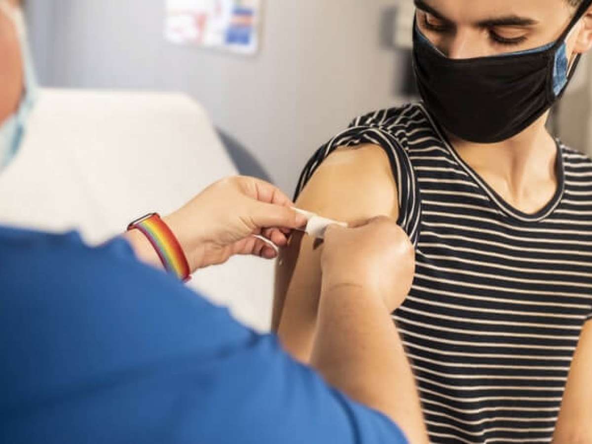 Boy getting COVID vaccine