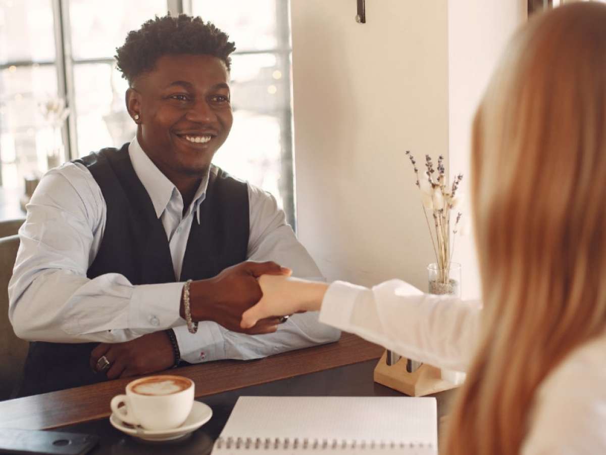 Teen boy shaking hands during a job interview