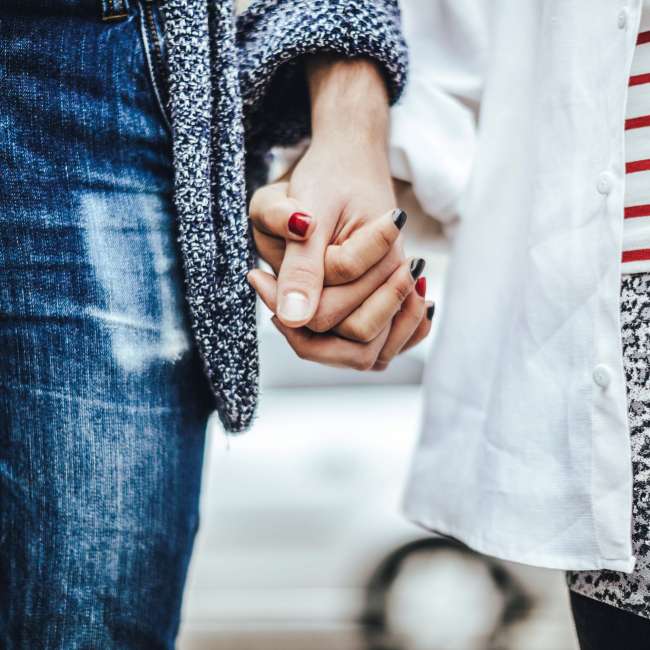 Girl and boy holding hands